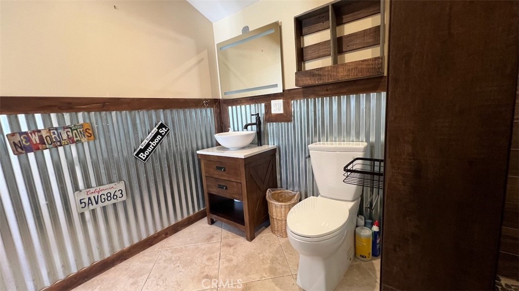 10908 Canby Avenue Porter Ranch, CA 91326 - Photo 26 of 26 a white toilet sitting next to a window