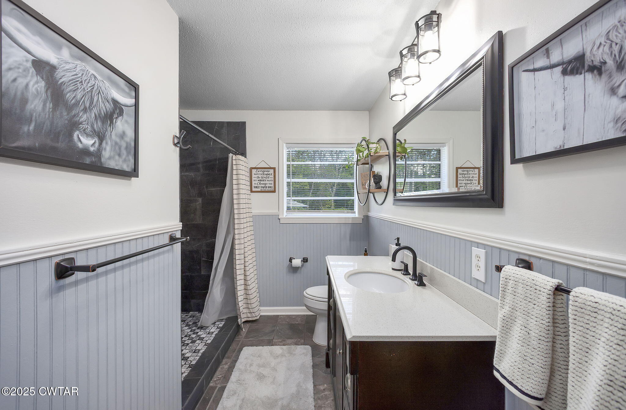 2735 Blue Goose Road Huron, TN 38345 - Photo 22 of 51 a bathroom with a sink and mirror with wooden floor