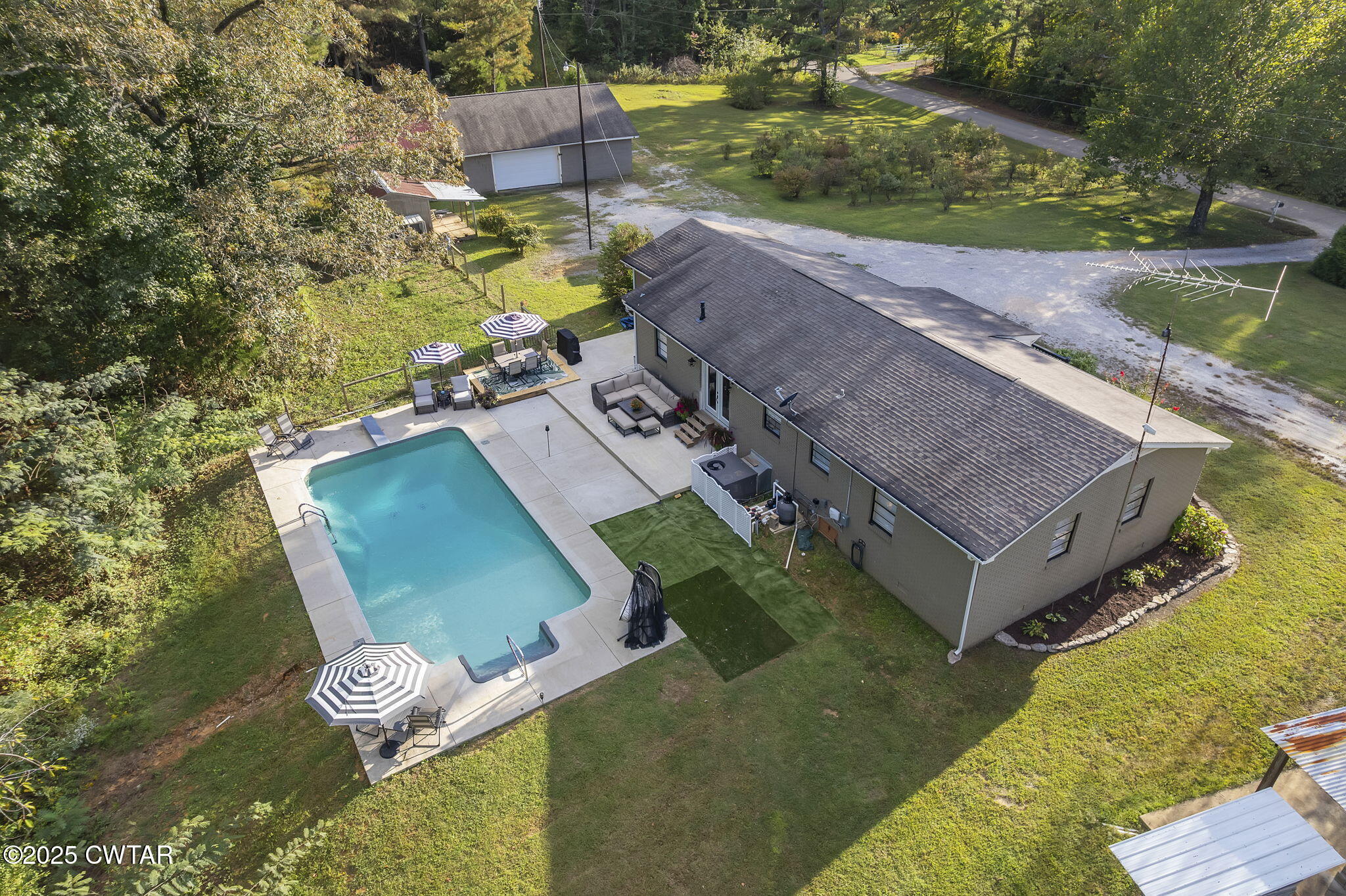 2735 Blue Goose Road Huron, TN 38345 - Photo 3 of 51 an aerial view of a house with a yard basket ball court and outdoor seating