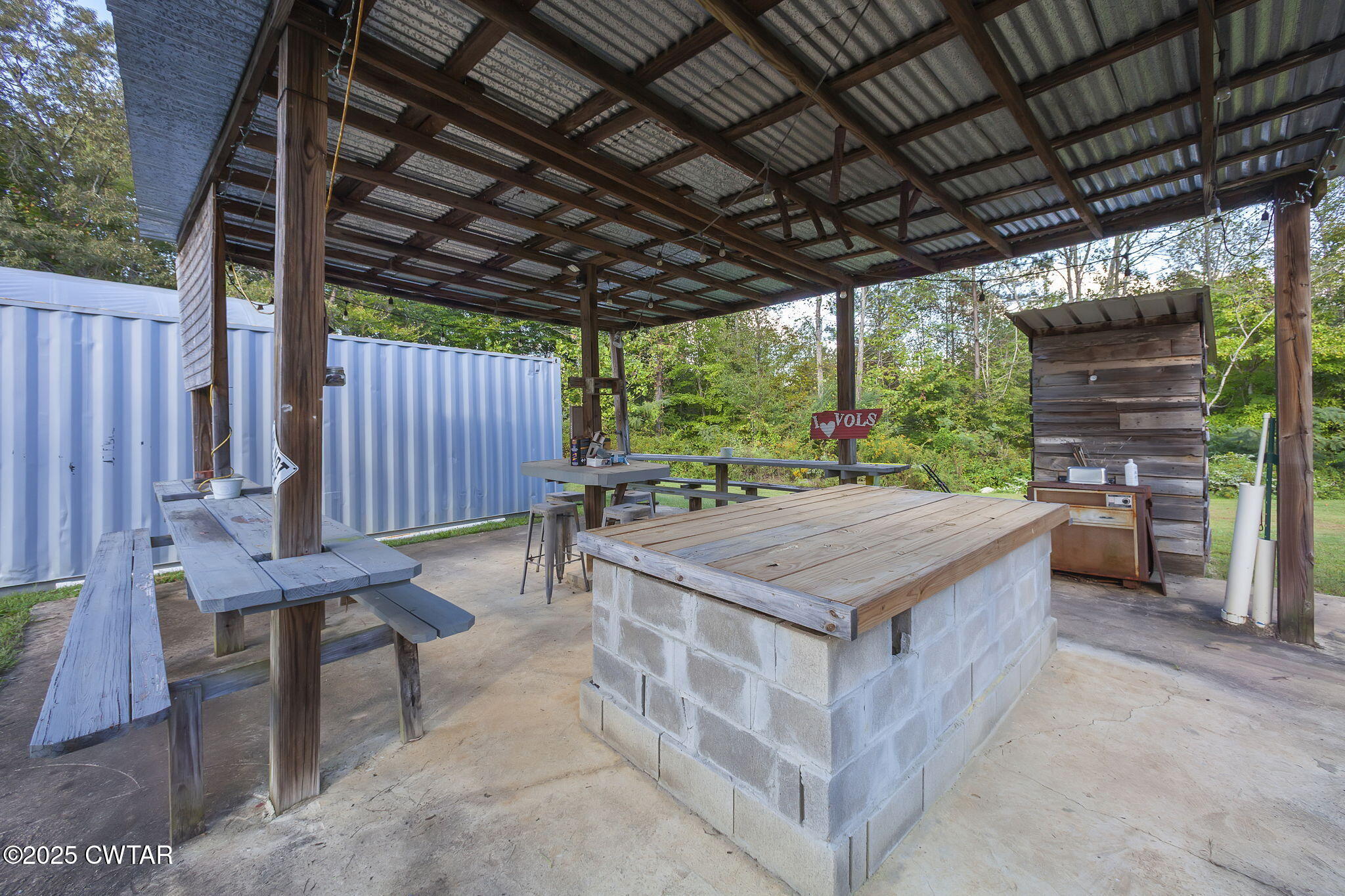 2735 Blue Goose Road Huron, TN 38345 - Photo 4 of 51 a view of a patio with a table and chairs
