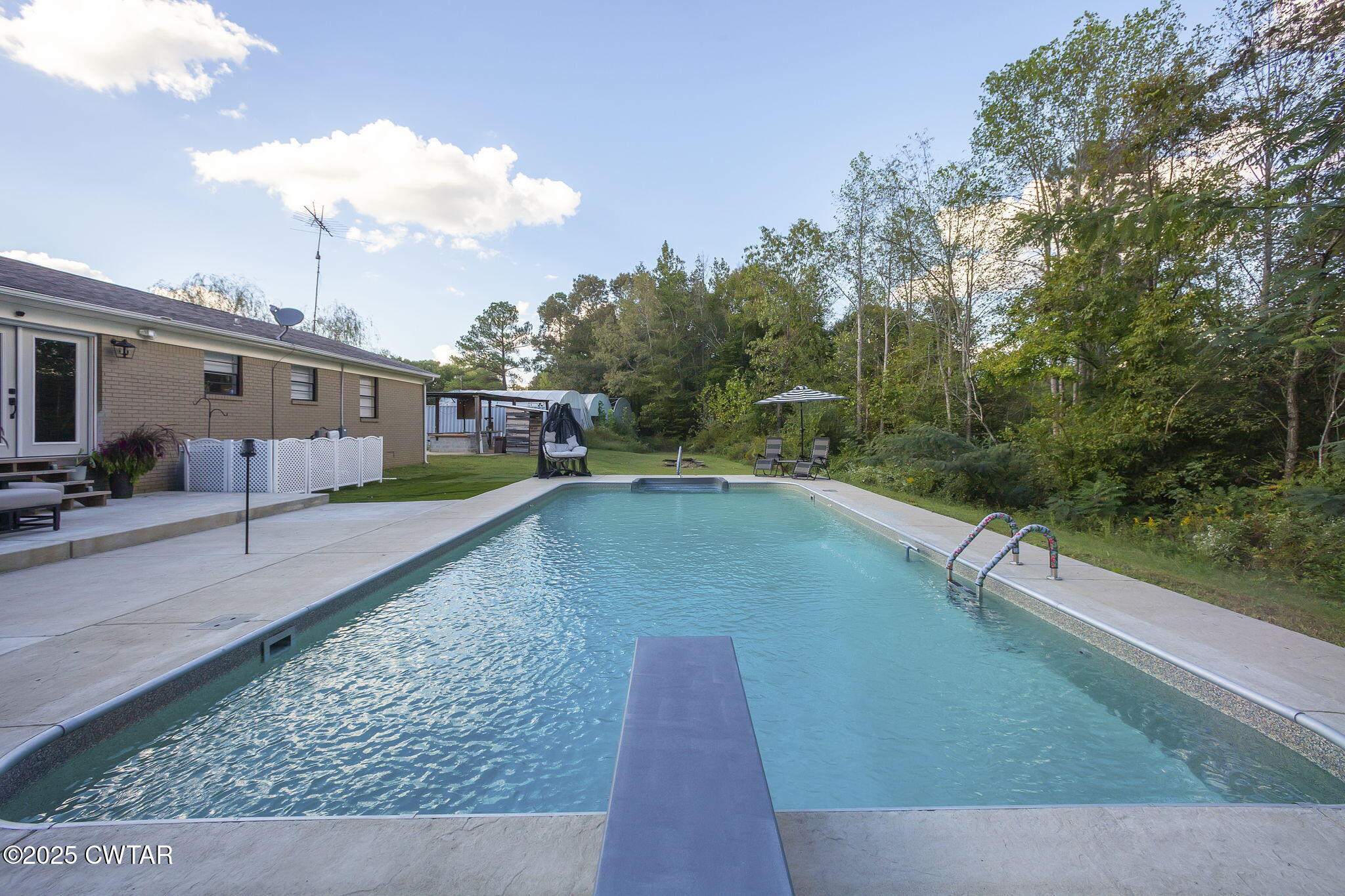 2735 Blue Goose Road Huron, TN 38345 - Photo 41 of 51 a view of a swimming pool with a yard