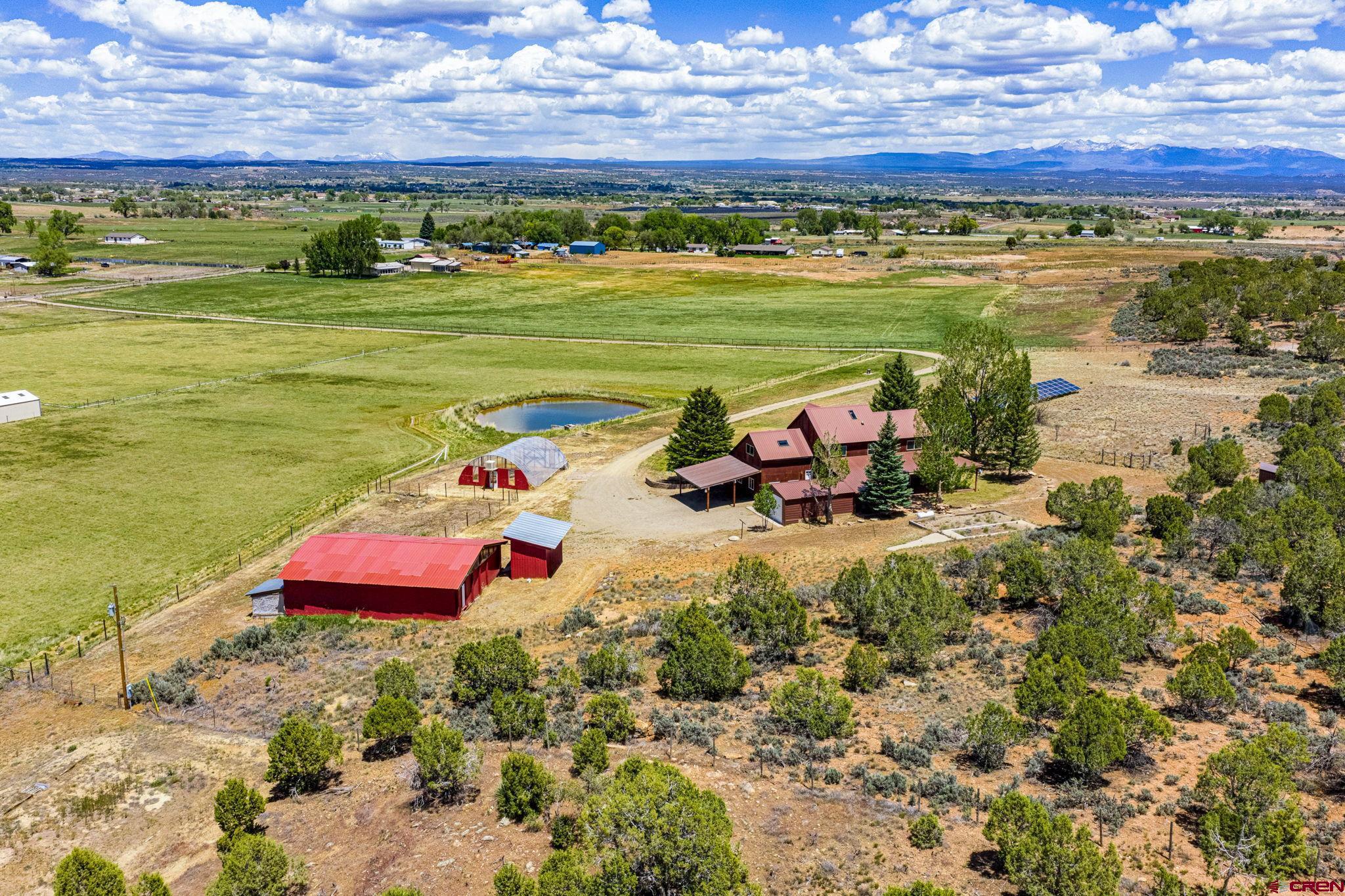 22480 Rd L Cortez, CO 81321 - Photo 38 of 44 a view of a lake with a building in the background
