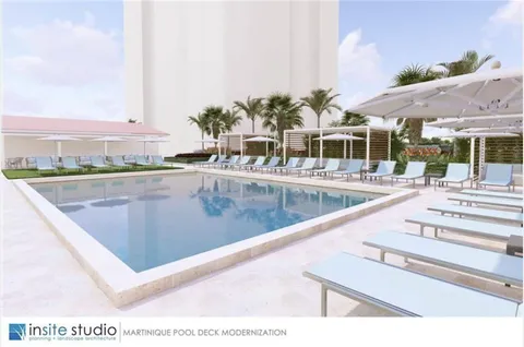 a view of a swimming pool with an outdoor seating