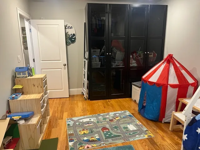 a bedroom with a bed and a mirror