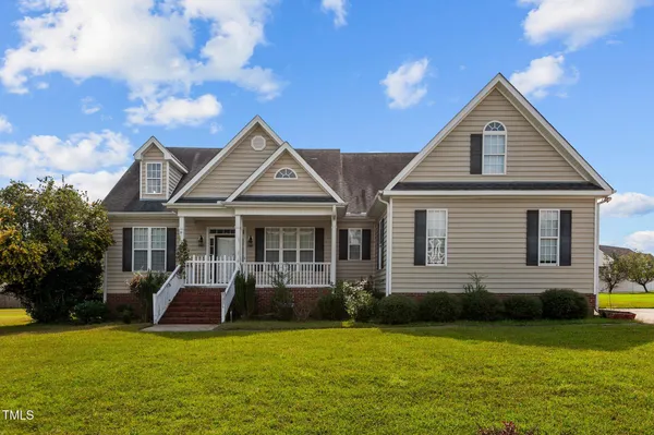 a front view of a house with a yard