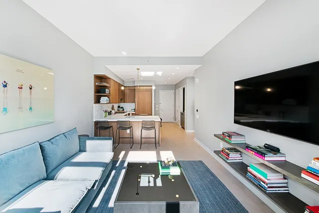 a kitchen with a refrigerator a sink and a stove