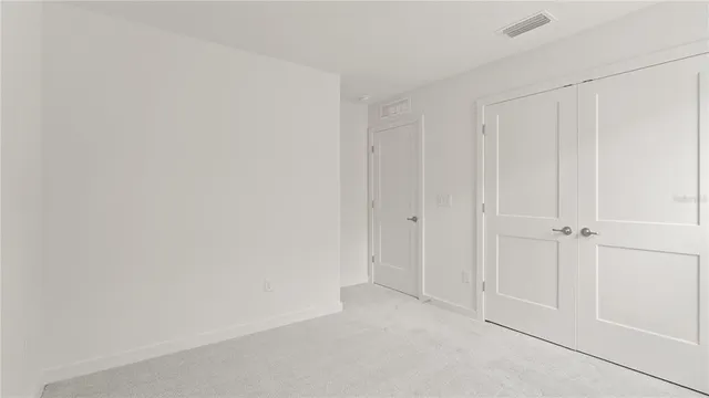 a view of a hallway with closet area