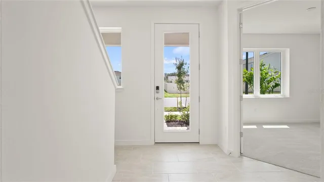 a kitchen with kitchen island sink stove and refrigerator