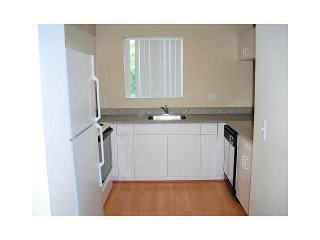791 North Pine Island Road, Unit 214 Plantation, FL 33324 - Photo 12 of 23 a utility room with a sink a mirror and a window