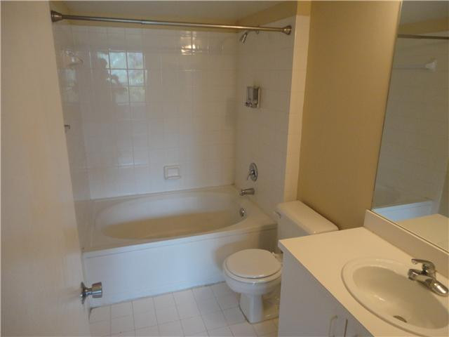 791 North Pine Island Road, Unit 214 Plantation, FL 33324 - Photo 17 of 23 a bathroom with a sink a toilet and shower