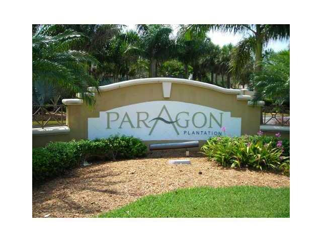 791 North Pine Island Road, Unit 214 Plantation, FL 33324 - Photo 4 of 23 a front view of a house with a garden