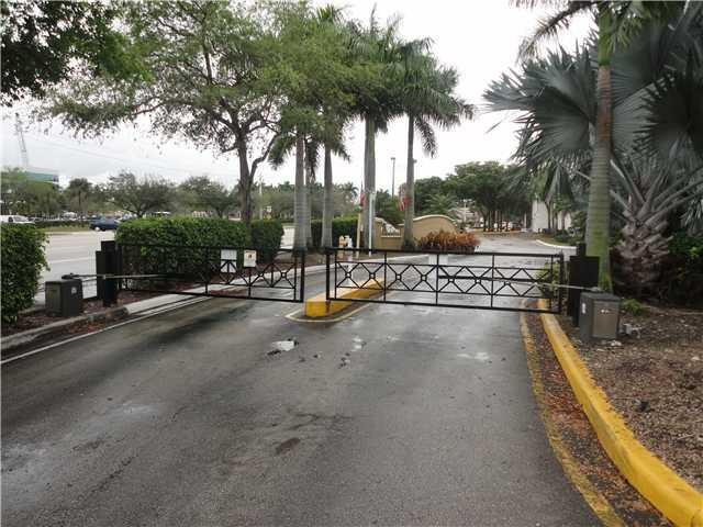 791 North Pine Island Road, Unit 214 Plantation, FL 33324 - Photo 5 of 23 a view of a street with a building in the background