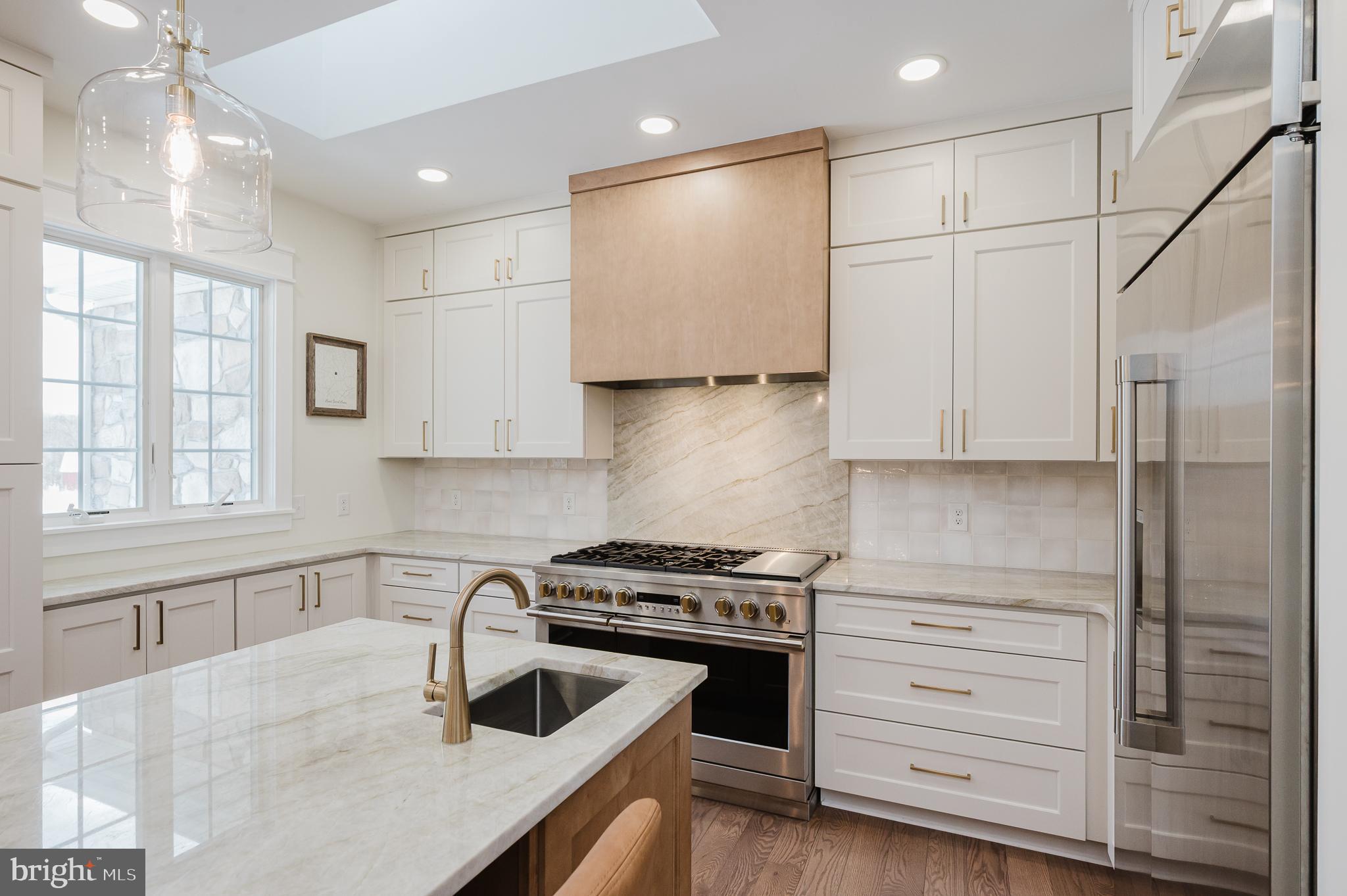 4532 Flintville Road Whiteford, MD 21160 - Photo 26 of 83 a kitchen with granite countertop a stove a sink and a refrigerator