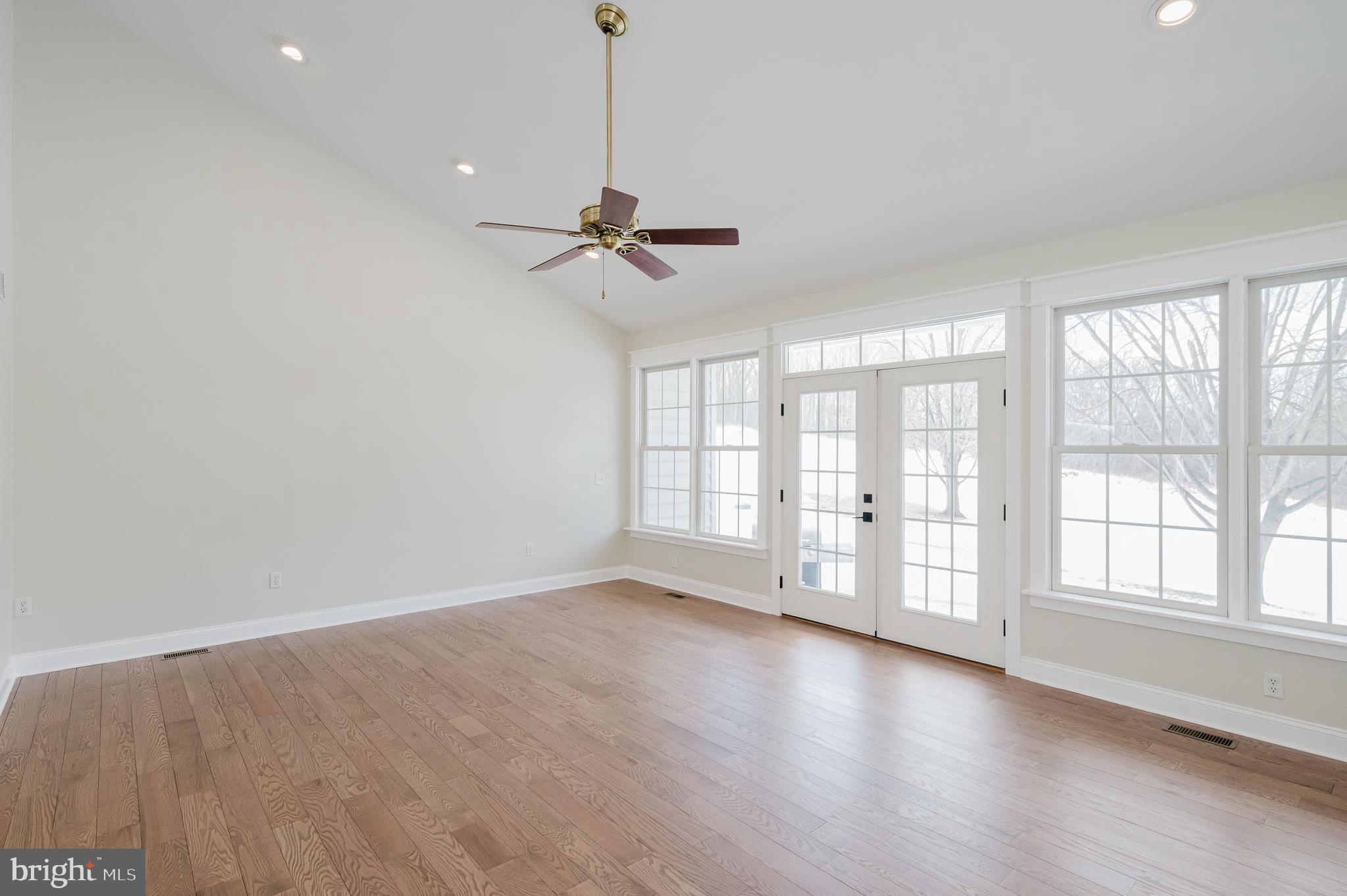 4532 Flintville Road Whiteford, MD 21160 - Photo 32 of 83 a view of an empty room with a window and wooden floor