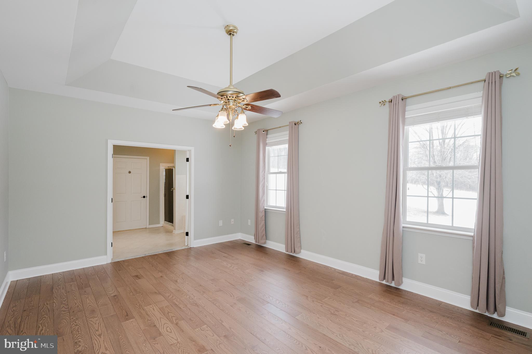 4532 Flintville Road Whiteford, MD 21160 - Photo 40 of 83 an empty room with wooden floor chandelier and windows
