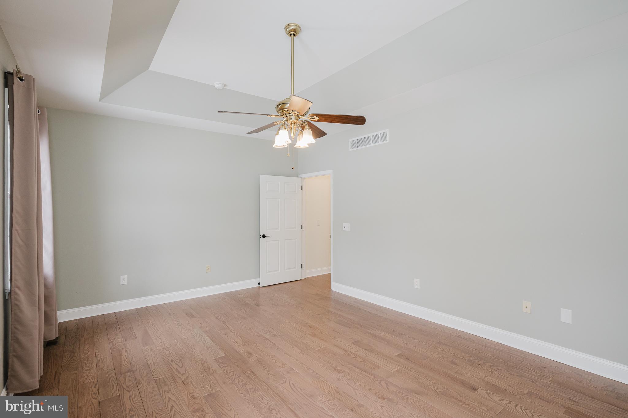 4532 Flintville Road Whiteford, MD 21160 - Photo 42 of 83 a view of a room with a chandelier fan and a wooden floor