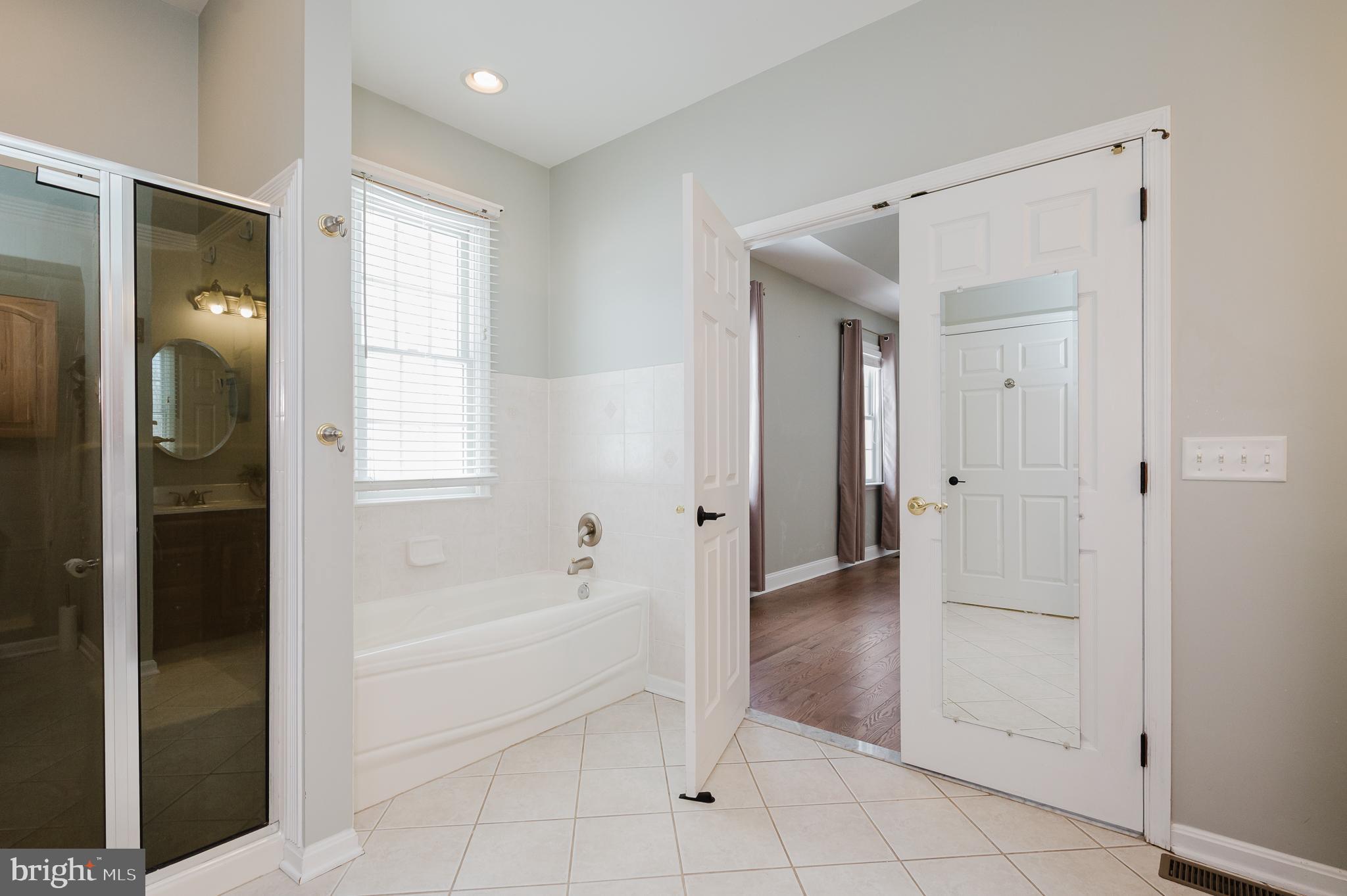4532 Flintville Road Whiteford, MD 21160 - Photo 45 of 83 a spacious bathroom with a bathtub and a shower