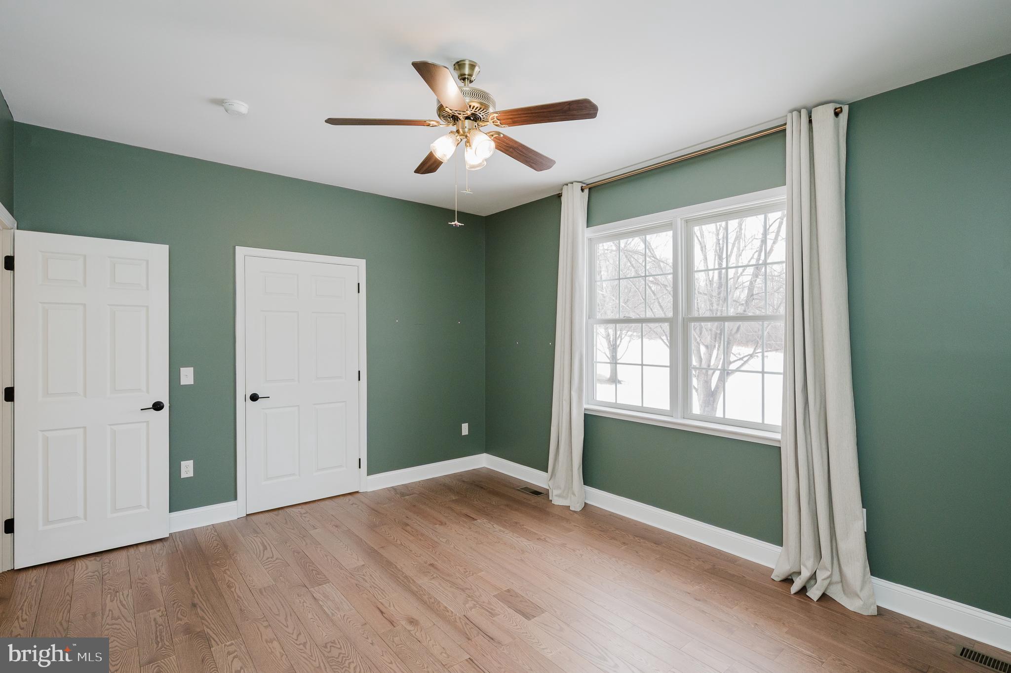 4532 Flintville Road Whiteford, MD 21160 - Photo 50 of 83 a view of an empty room with wooden floor and a window