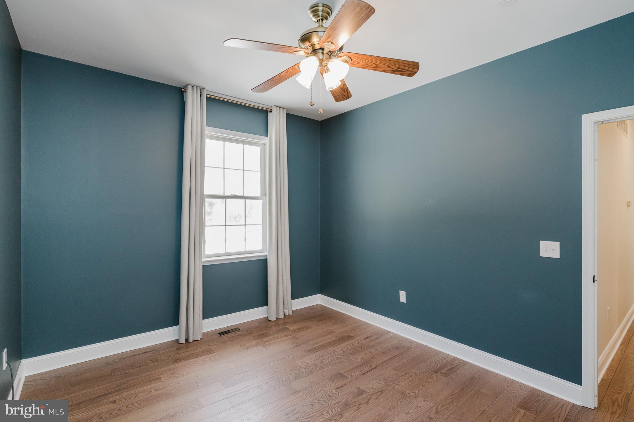 4532 Flintville Road Whiteford, MD 21160 - Photo 55 of 83 an empty room with windows and fan