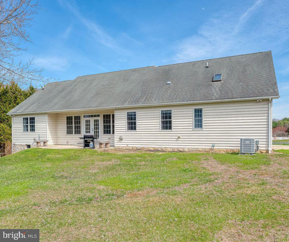 4532 Flintville Road Whiteford, MD 21160 - Photo 66 of 83 a backyard of a house with table and chairs and potted plants