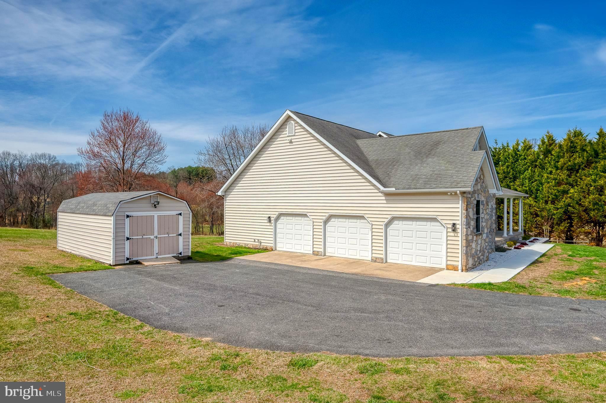 4532 Flintville Road Whiteford, MD 21160 - Photo 10 of 83 a front view of a house with a yard and garage