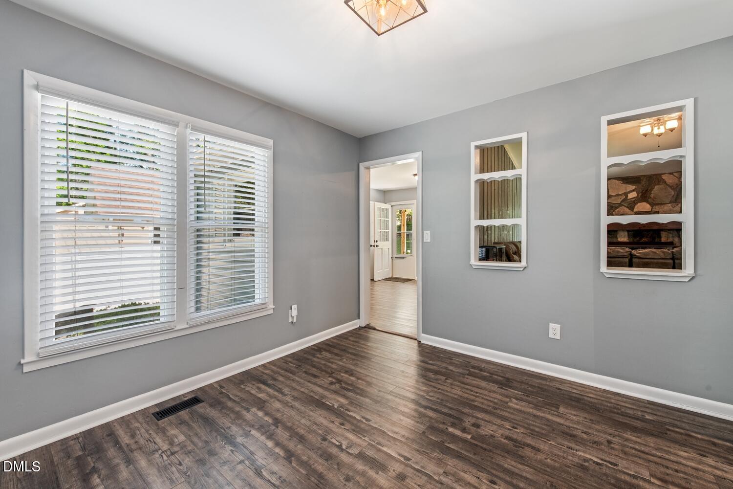 134 Longview Road Madison, NC 27025 - Photo 10 of 49 a view of an empty room with wooden floor and a window