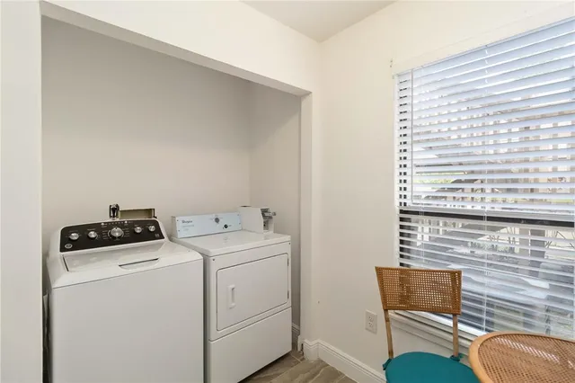 a utility room with dryer and washer