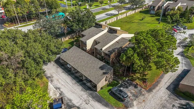 an aerial view of a house with a garden