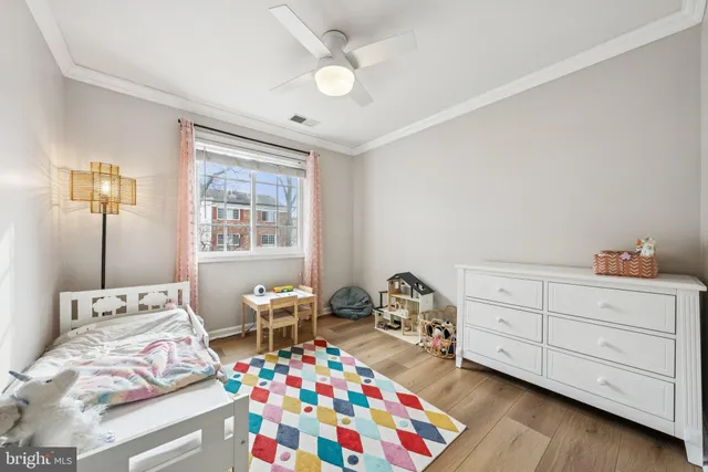 a bedroom that has a bed and a table in it