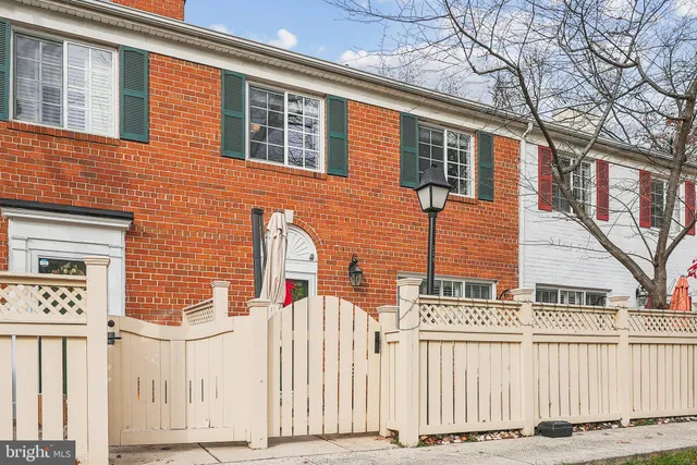 a front view of a house with a fence