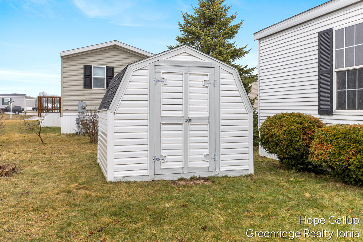 360 East Tuttle Road, Unit 183 Ionia, MI 48846 - Photo 3 of 16 FRONT VIEW WITH SHED