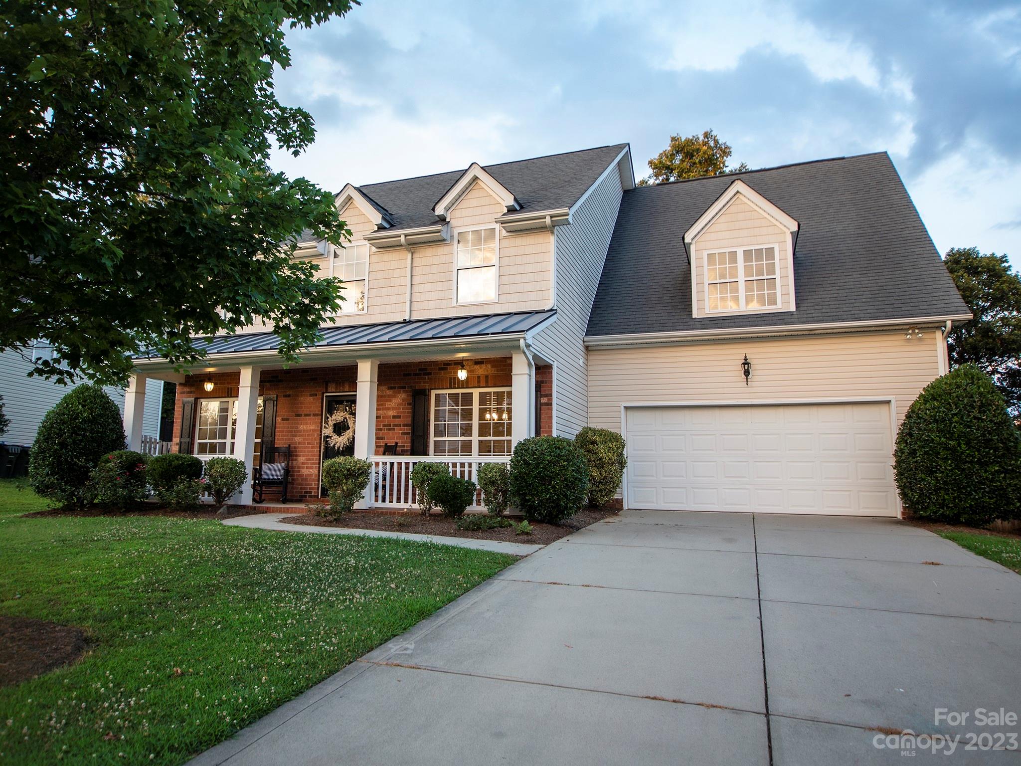 3437 Norwich Road Fort Mill, SC 29715 - Photo 2 of 46 a front view of a house with a yard and garage