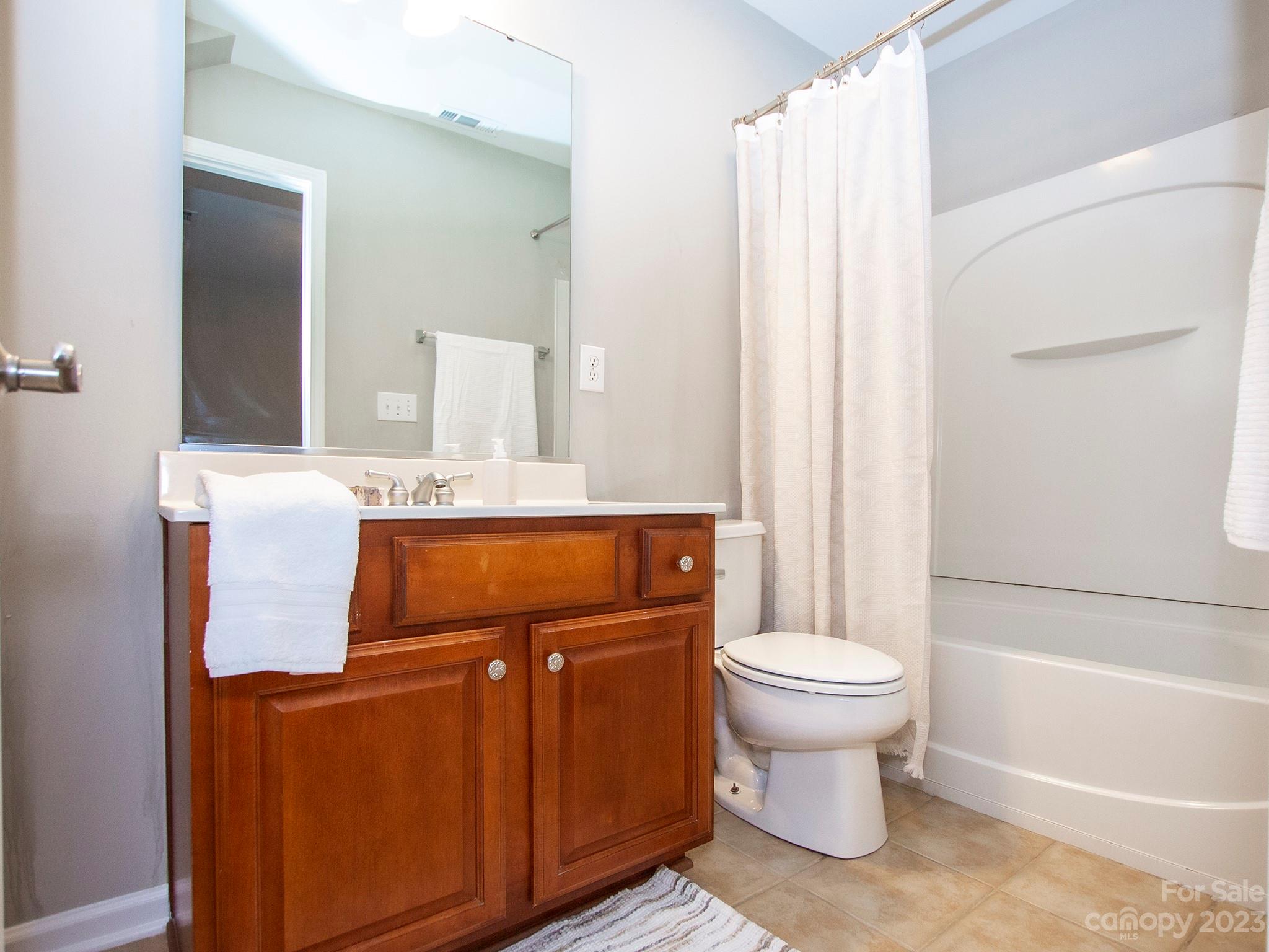3437 Norwich Road Fort Mill, SC 29715 - Photo 26 of 46 a bathroom with a granite countertop toilet sink and mirror