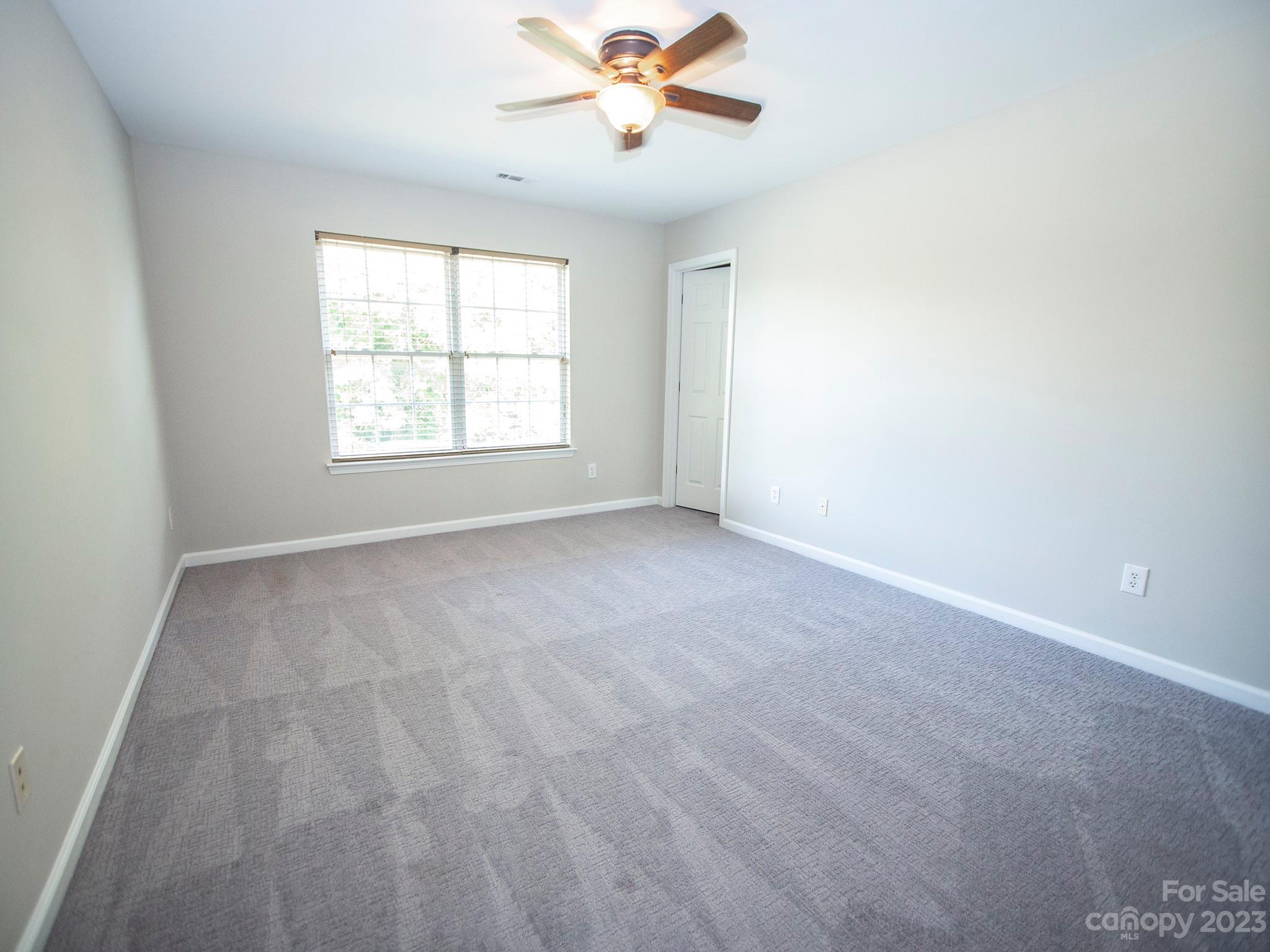 3437 Norwich Road Fort Mill, SC 29715 - Photo 30 of 46 an empty room with windows and fan