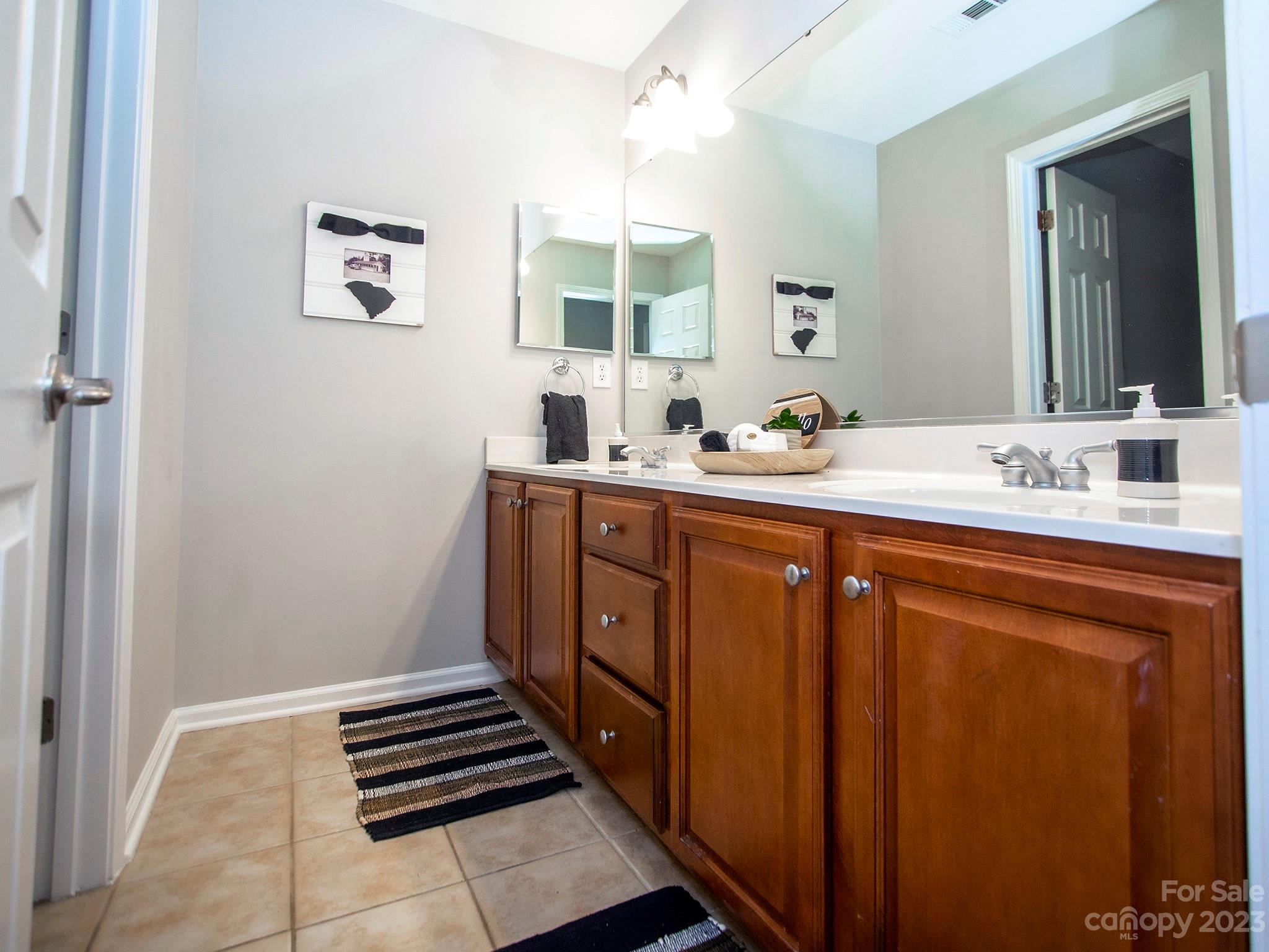 3437 Norwich Road Fort Mill, SC 29715 - Photo 31 of 46 a bathroom with a sink a vanity and a mirror
