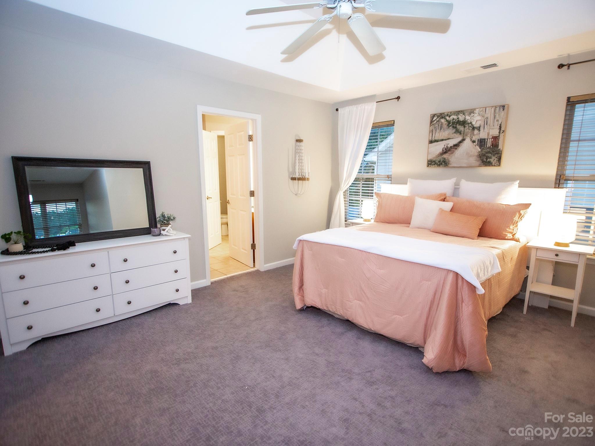 3437 Norwich Road Fort Mill, SC 29715 - Photo 34 of 46 a spacious bedroom with a bed and a flat screen tv