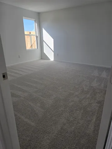 a view of an empty room and window