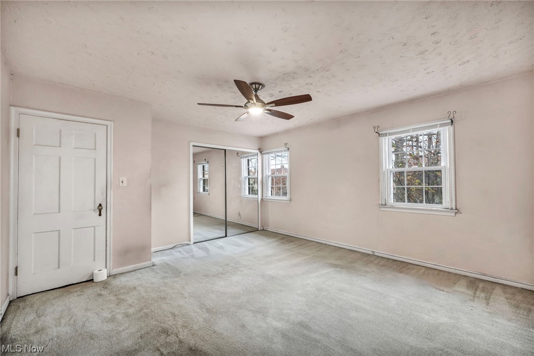 3946 Lansdale Road Cleveland, OH 44118 - Photo 29 of 42 Bedroom featuring ceiling fan, a textured ceiling, and light carpet