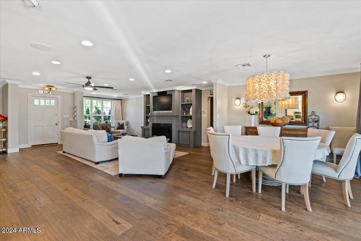 3841 East Elm Street Phoenix, AZ 85018 - Photo 17 of 72 a living room with furniture and a chandelier