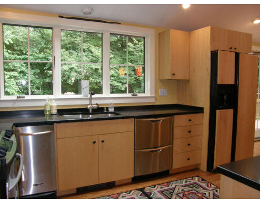 19 Oxbow Road Lexington, MA 02421 - Photo 8 of 23 a kitchen with stainless steel appliances granite countertop a refrigerator and a sink