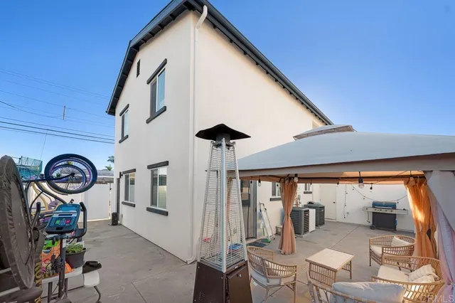 a view of a patio with table and chairs