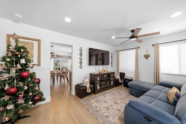 a living room with furniture and flowers