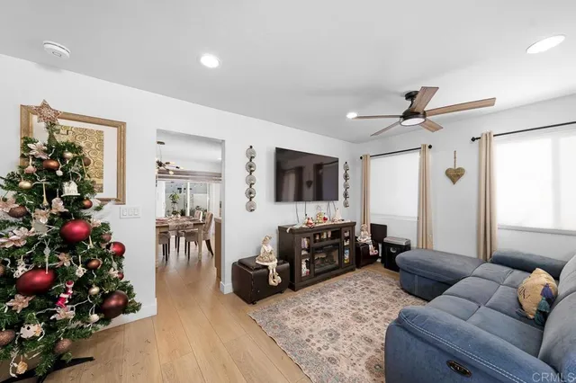 a living room with furniture and flowers