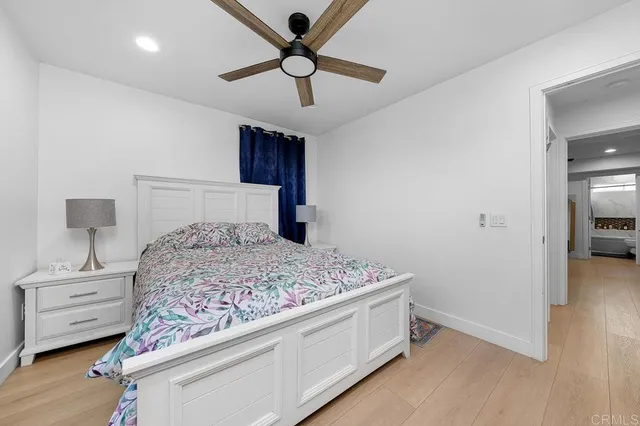 a bedroom with a bed and a tv