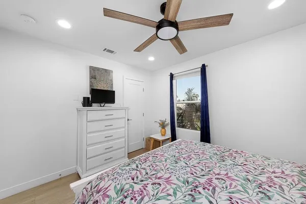 a bed room with a bed and a window