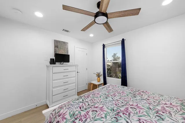 a bed room with a bed and a window