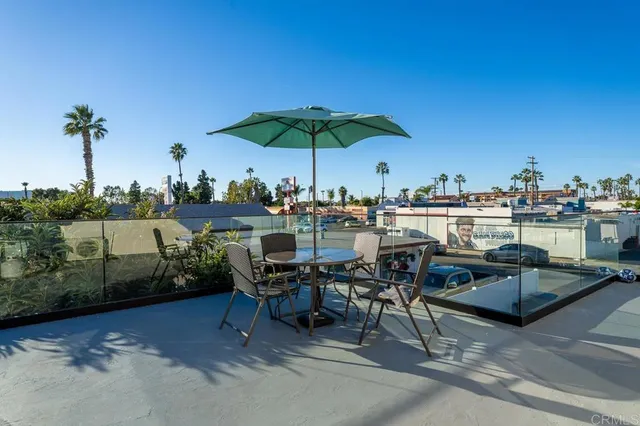 a view of a terrace with furniture and stove