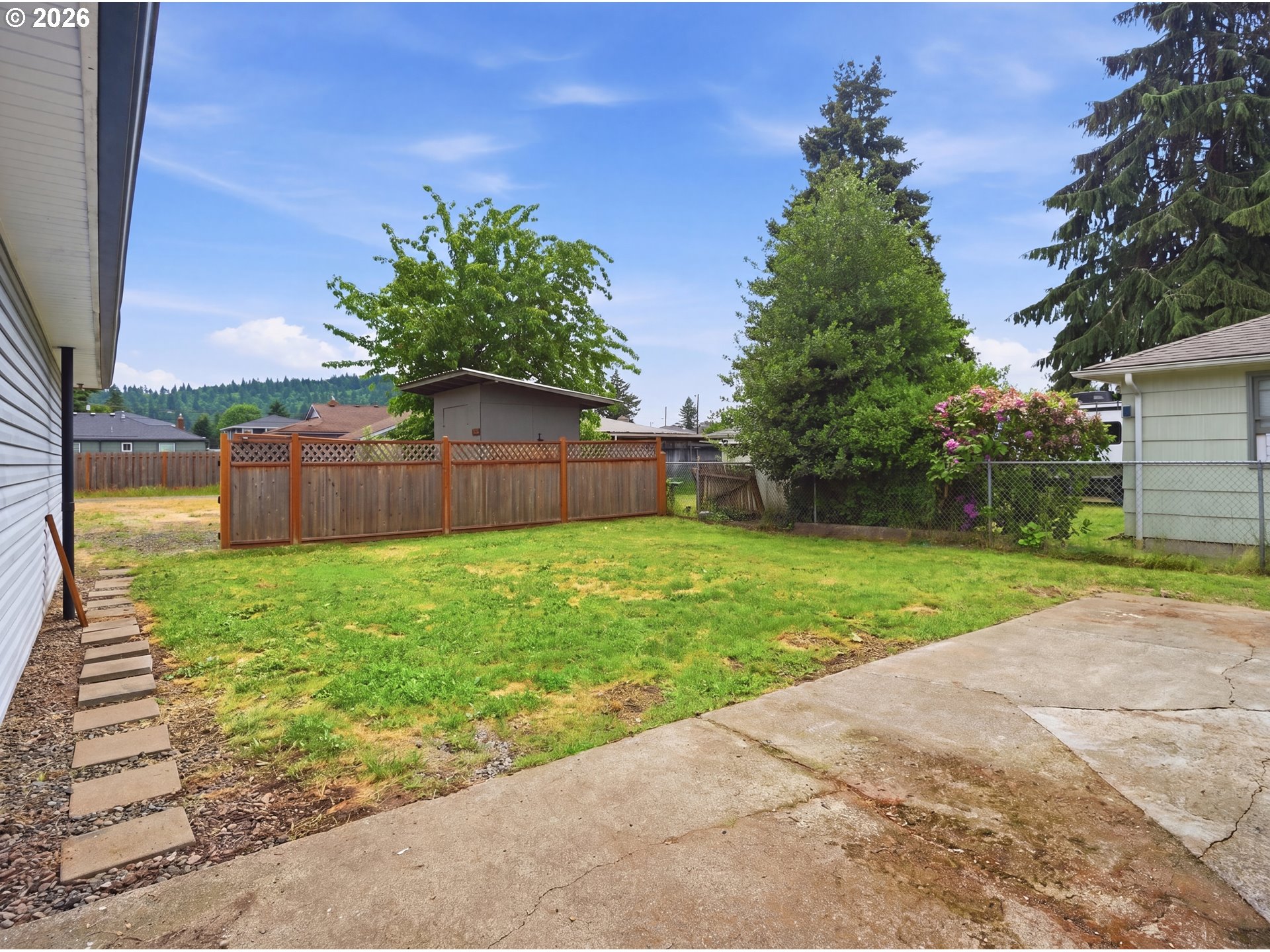 1357 Grove Street Lebanon, OR 97355 - Photo 27 of 37 a backyard of a house with lots of green space