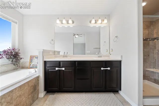 a bathroom with a bathtub and a shower