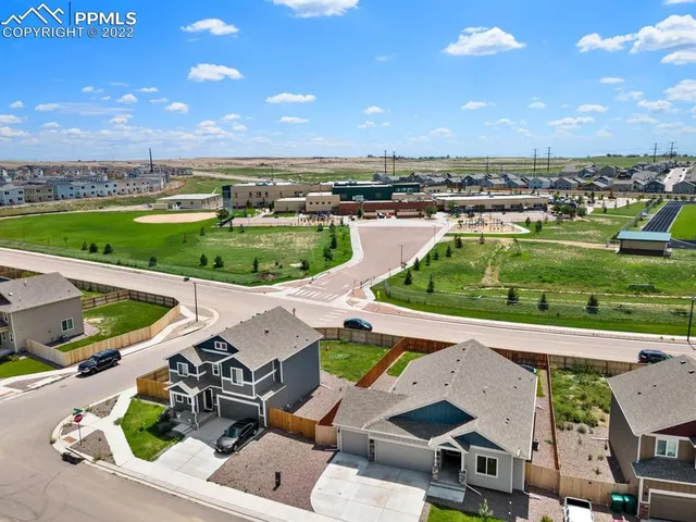 an aerial view of a house with a garden